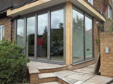 Mr E : Garstang, Lancashire : Installtion of a Centor C1 Tripler Glazed Bi Fold door with a fixed frame sidelight in our "Allstyle" Thermally Broken window system 